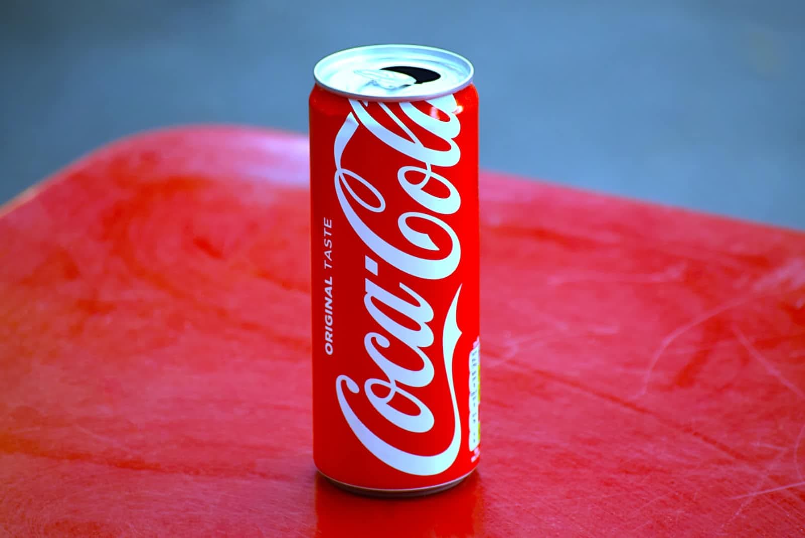 How does Coca-Cola use AI to create its latest beverage